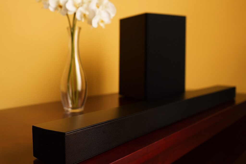 AI-generated image of a plain black soundbar on a mahogany console with a subwoofer in the background.