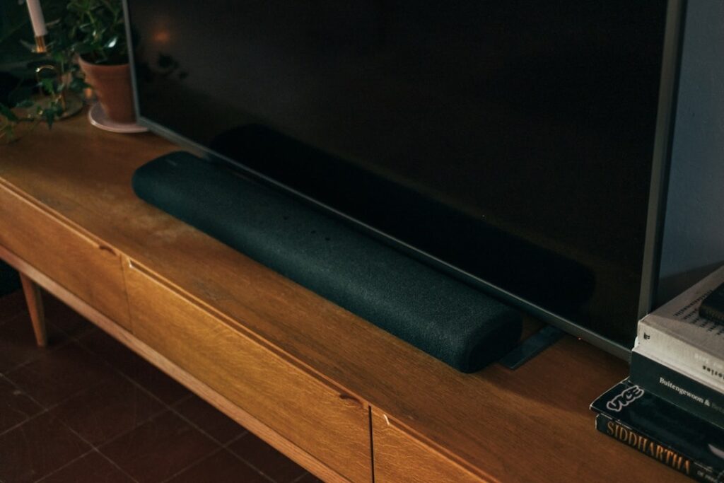 Image of a black soundbar in front of a TV